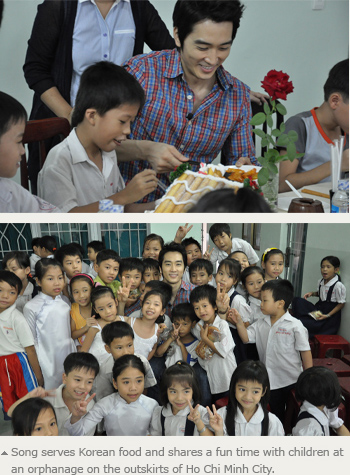 Song serves Korean food and shares a fun time with children at an orphanage on the outskirts of Ho Chi Minh City. 